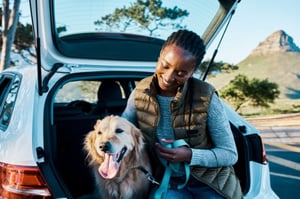 owner and dog in trunk