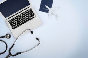 stethoscope next to computer