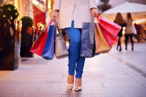 woman holding shopping bags