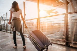 woman walking with suitcase