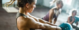 women working out with kettle bells